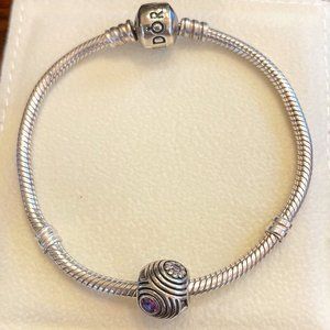 Silver Pandora charm with purple gemstones